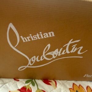 Christian Louboutin Brown Box with White Logo more of a coral color.